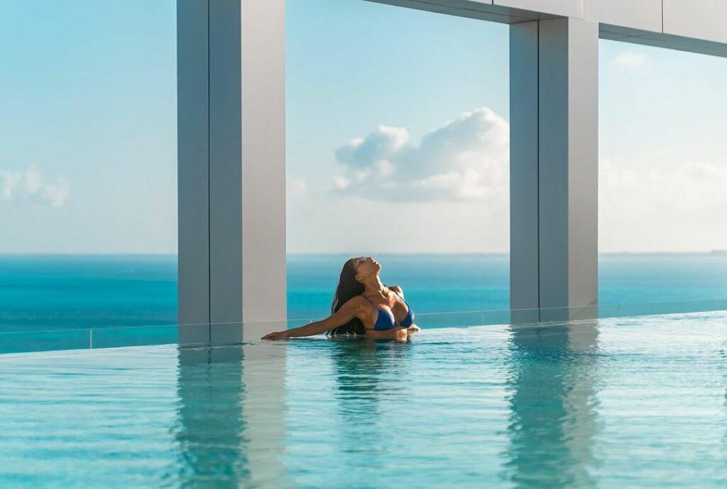 Nicole Scherzinger relaxing in the swimming pool.