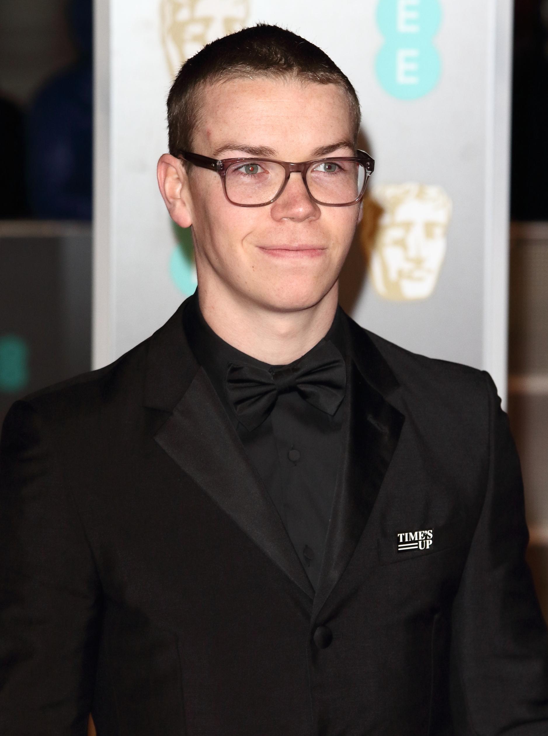 Will Poulter with glasses and a buzzed head