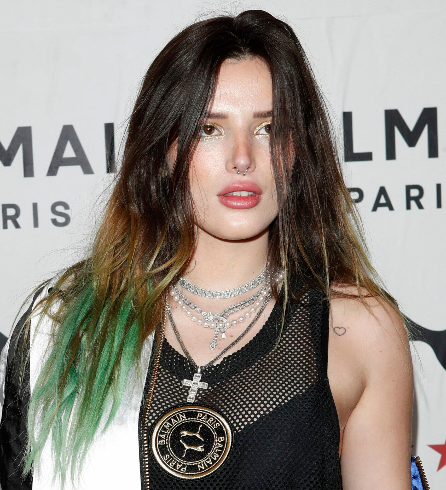 Bella Thorne Puts Toned Abs & Ample Cleavage On Display