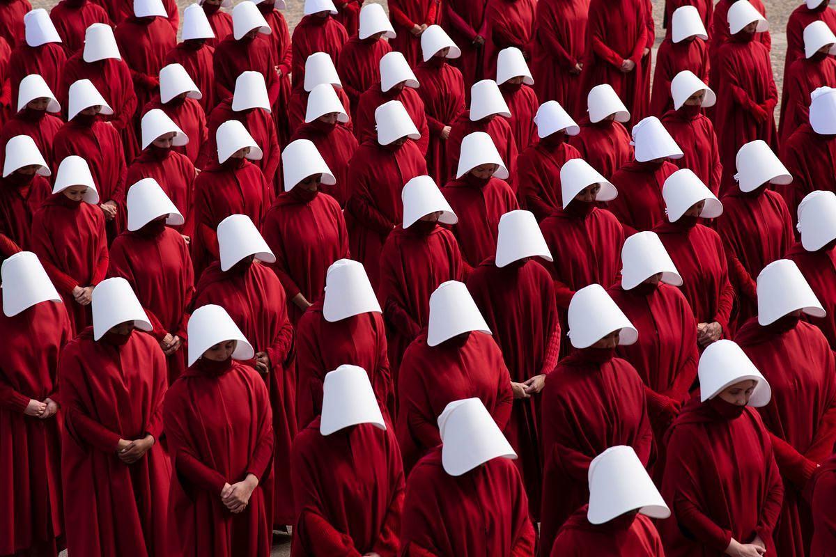 Women dress as handmaids to stand up for abortion rights