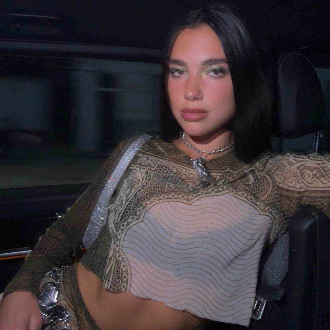 Dua Lipa wears a money-themed outfit