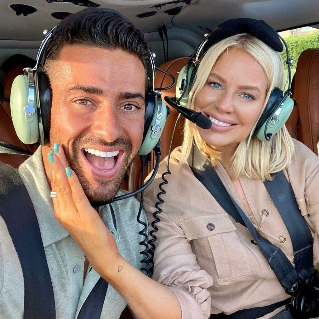 woman and man in a helicopter, excited.
