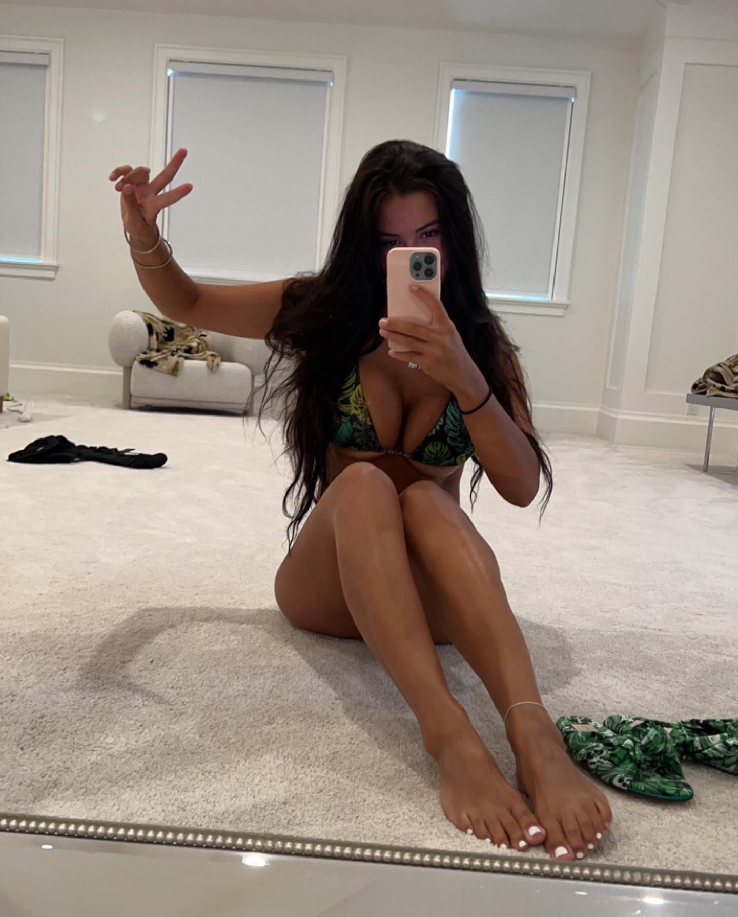 Rachel Bush Cups Busty Assets In An Itty Bitty Bikini