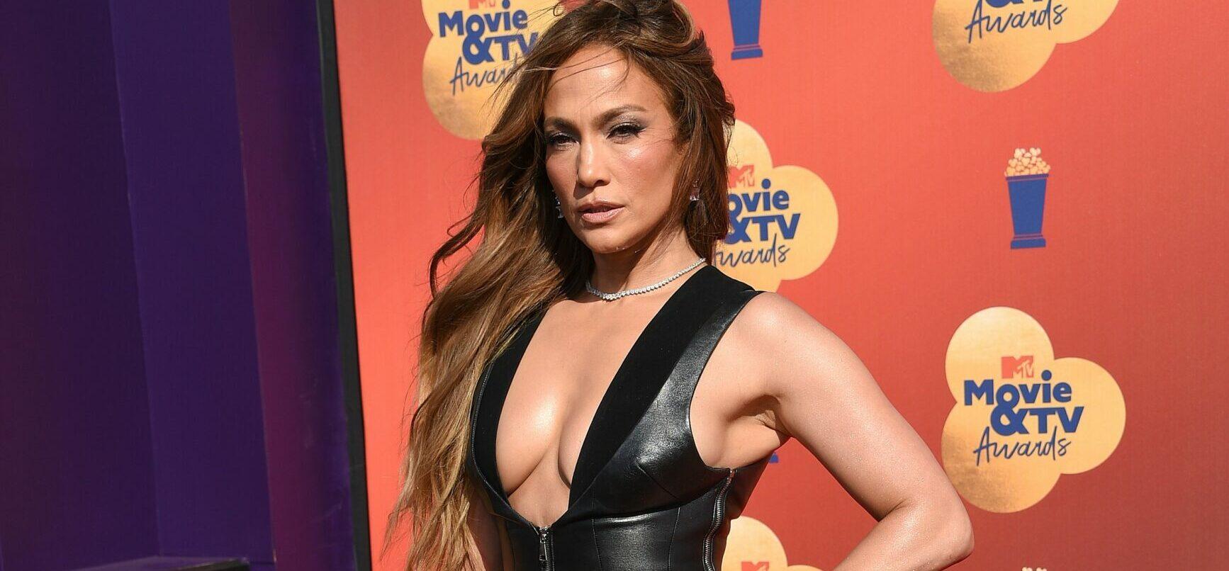Jennifer Lopez Puts Her Famous Rump On Display In A Black Bathing Suit For JLo Beauty