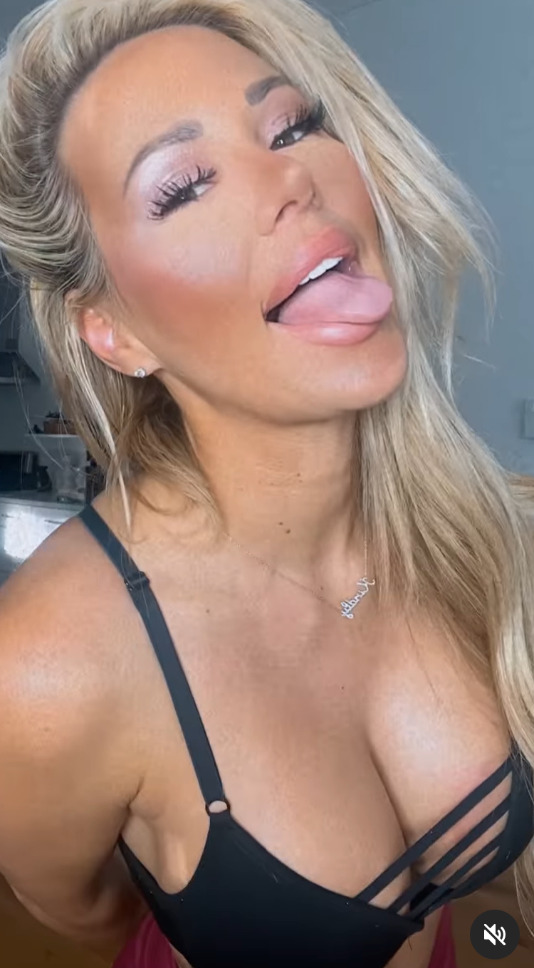 Kindly Myers Sticks Out Her Tongue In A Busty Black Bra