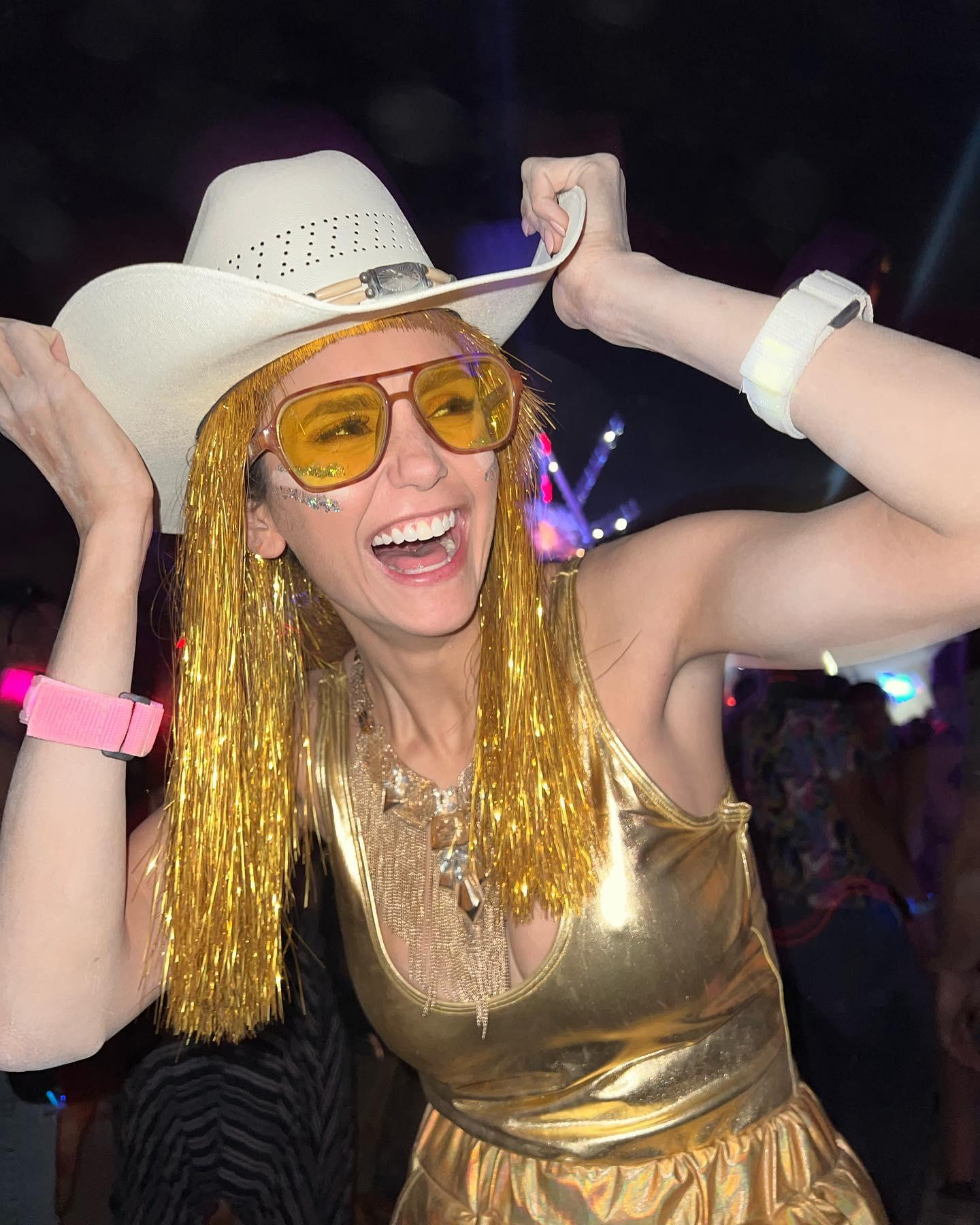 Nina Dobrev in her gold costume at Burning Man 2022