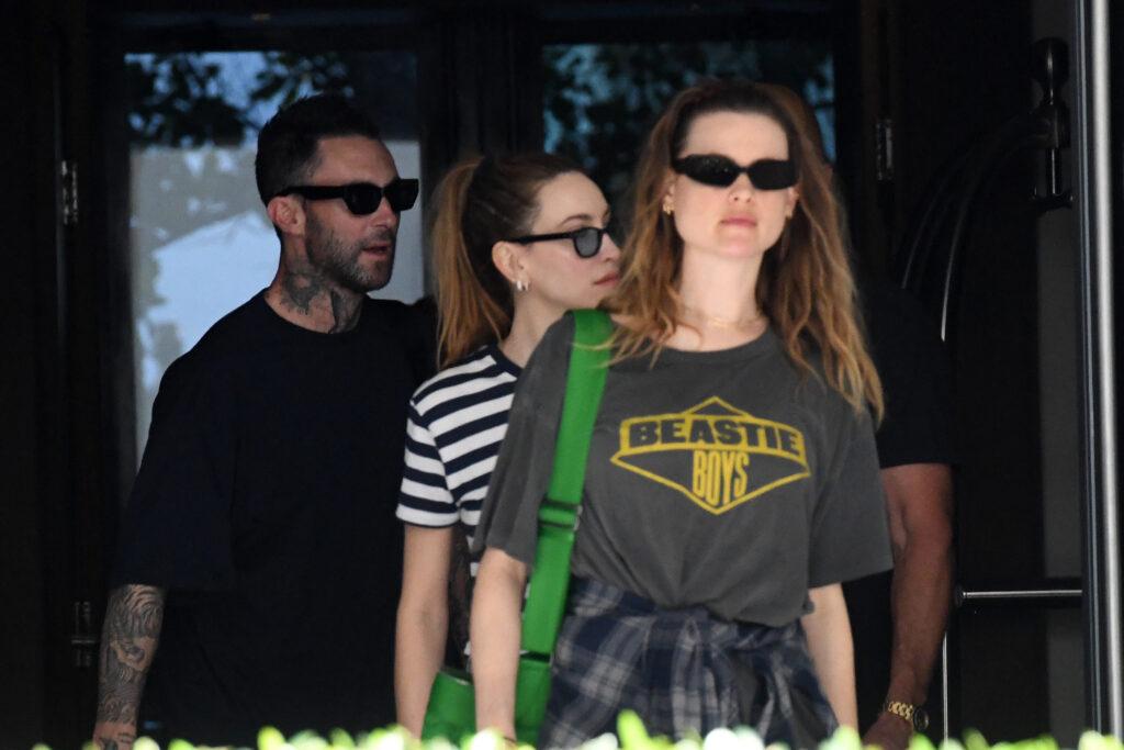 Adam Levine proves his new face tattoo was only temporary as he is seen leaving his hotel with wife Behati Prinsloo in Miami
