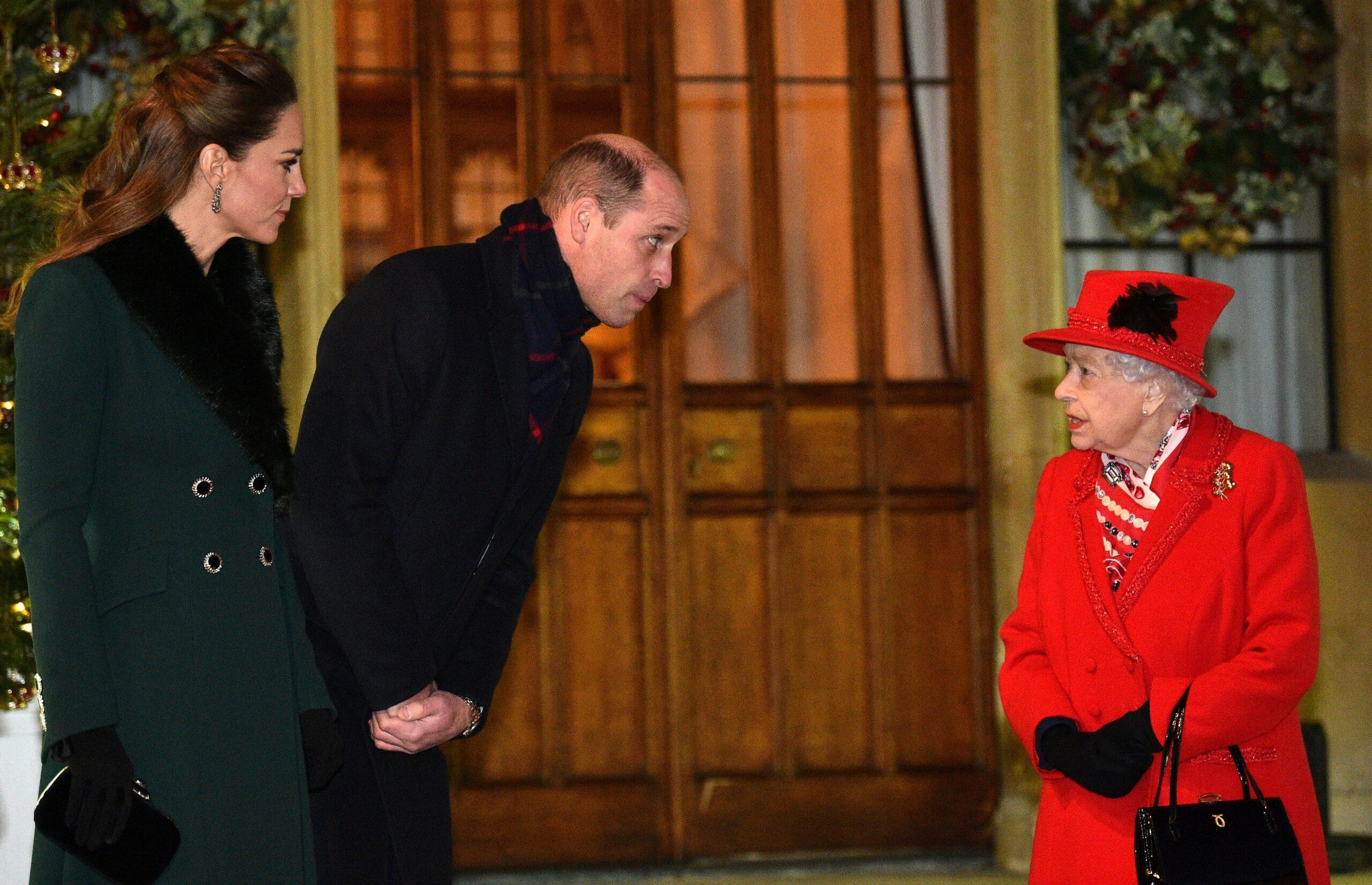 Queen Elizabeth II (R) talks with Britain's Prince William, Duke of Cambridge, (2L) and Britain's Catherine,Duchess of Cambridge,