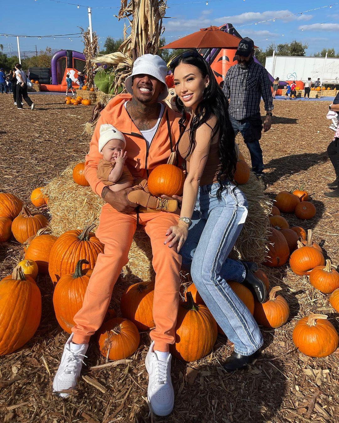Bre Tiesi & Nick Cannon with their son at pumpkin patch