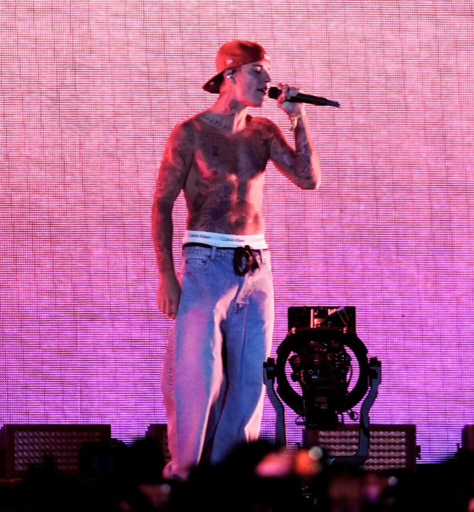 Justin Bieber goes shirtless performing with Justin Ceasar at Coachella Music Festival in Indio CA