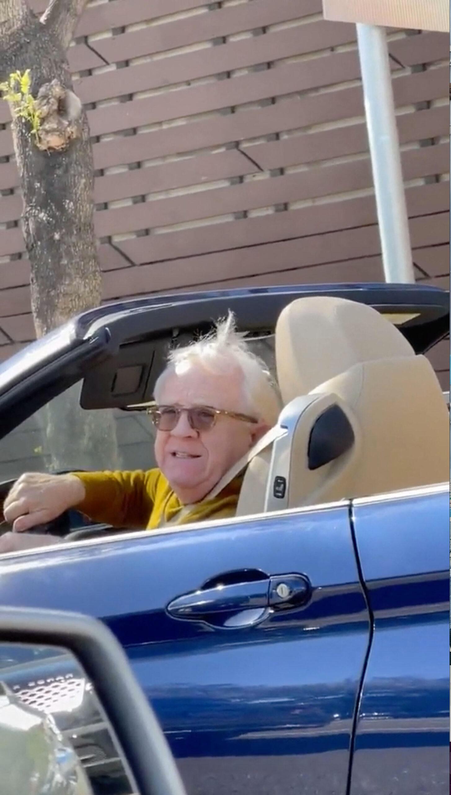 Leslie Jordan seen in April 2022 in his car as he joked with a fan at a red light