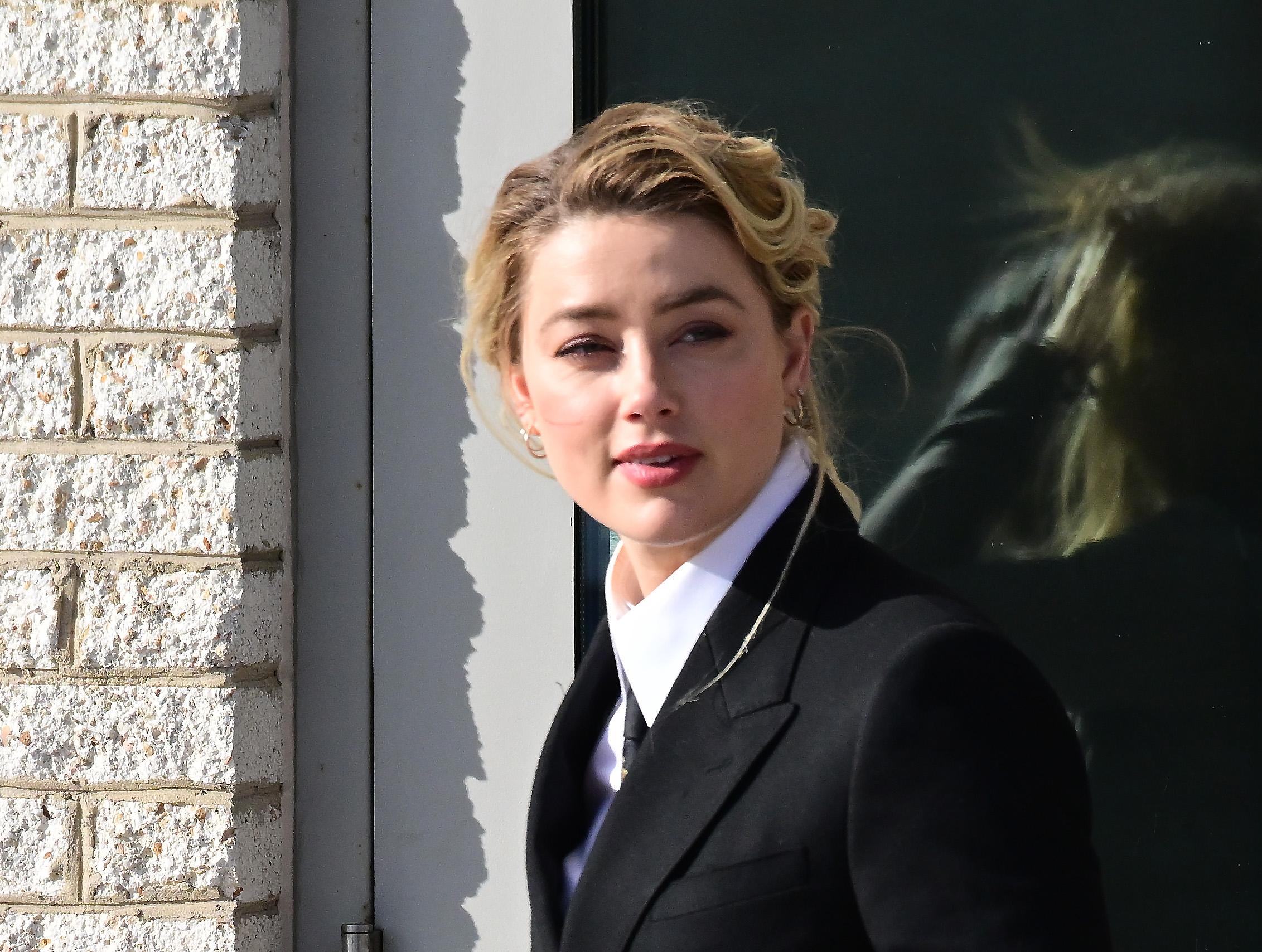 Amber Heard arrives for her trial at the Fairfax County Courthouse in Fairfax, Virginia