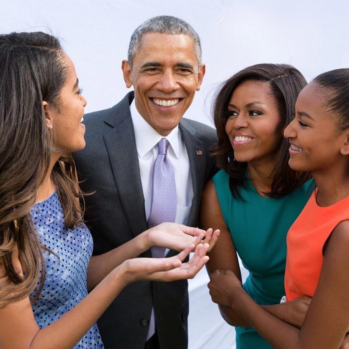 Barack & Michelle Obama with their daughters.