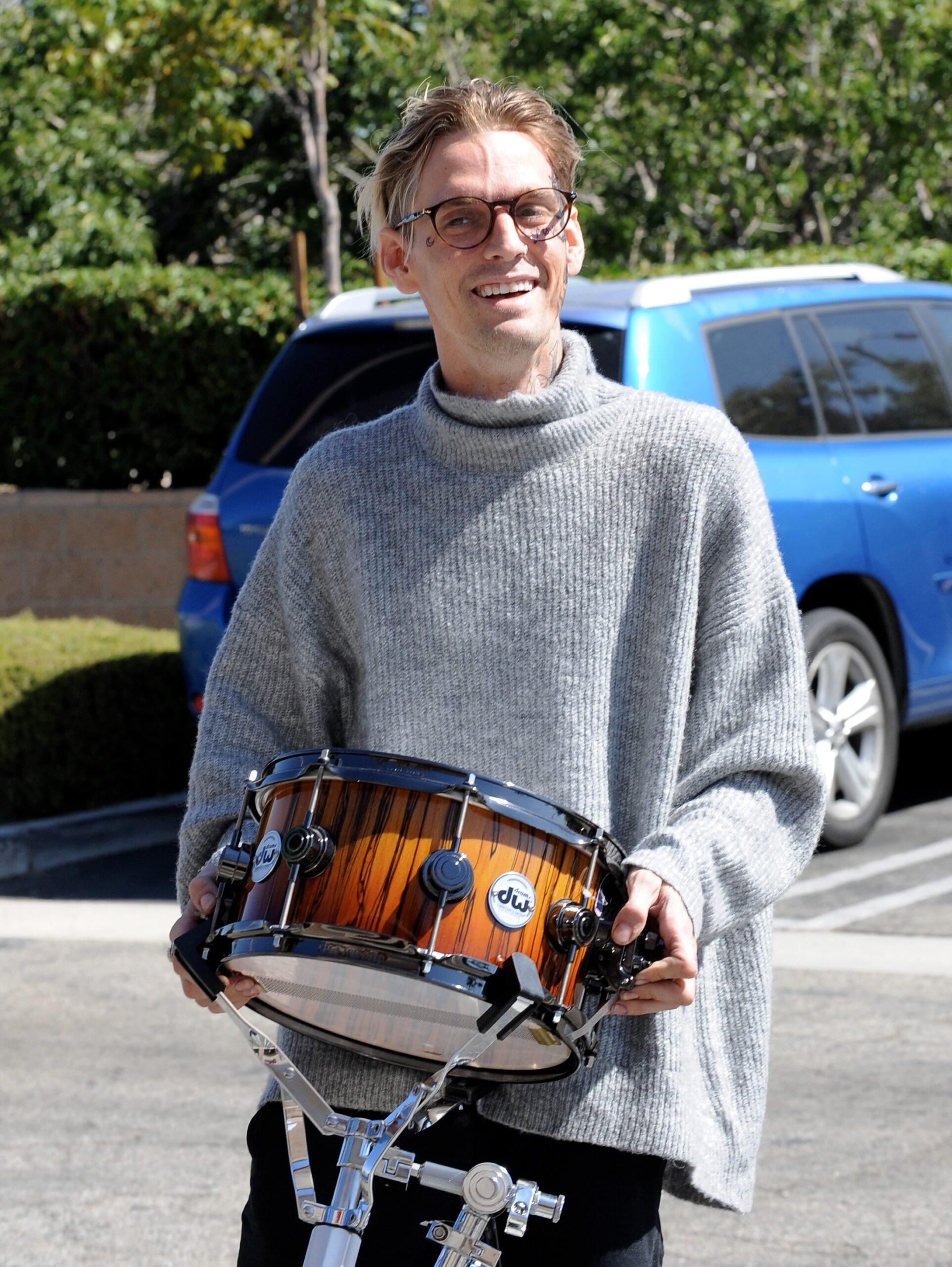 Aaron Carter new face tattoo at the Guitar Center