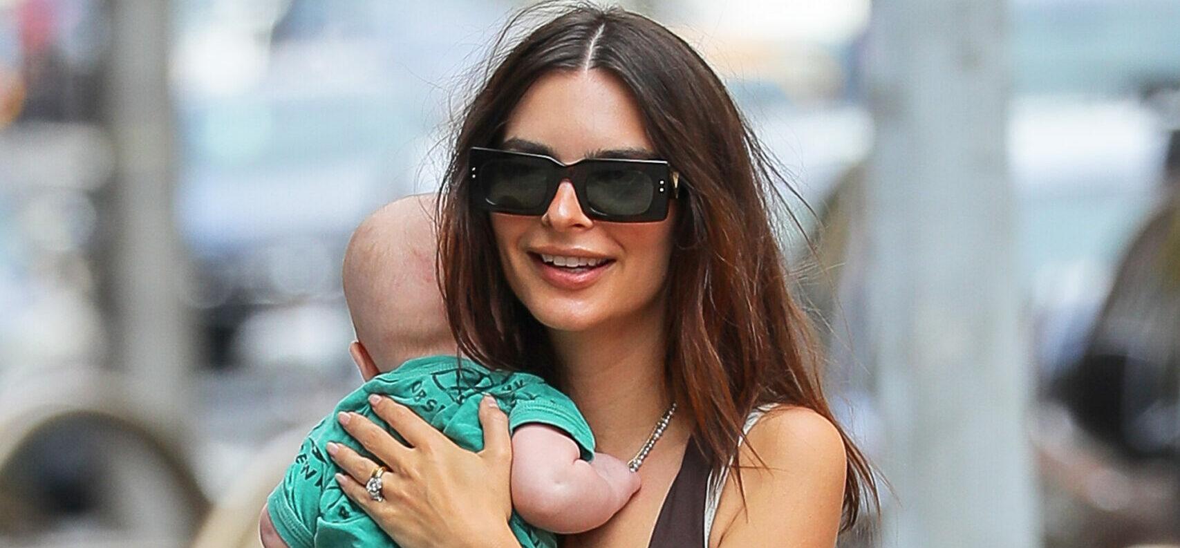 Emily Ratajkowski is all smiling while carrying her Baby as they taking a stroll with husband Sebastian Bear-McClard in NYC