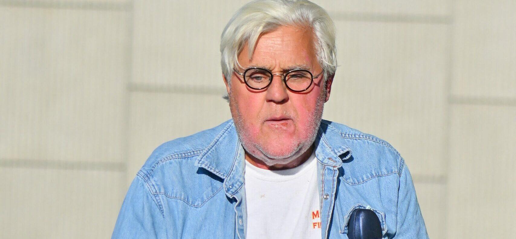 Jay Leno stops by a gas station in yet another cool car after getting out of the hospital yesterday