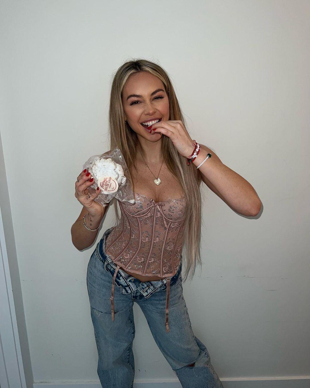 Corinne Olympios eating cookies