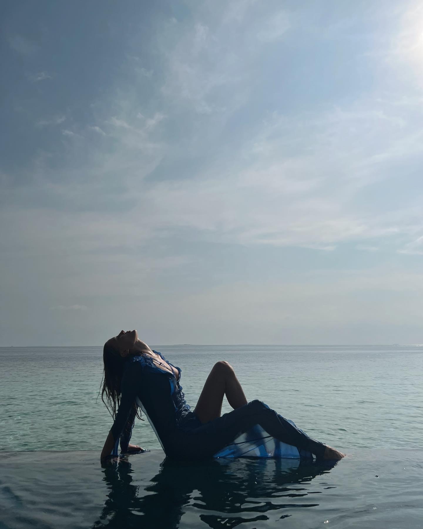 Nicole Poturalski poses in the water