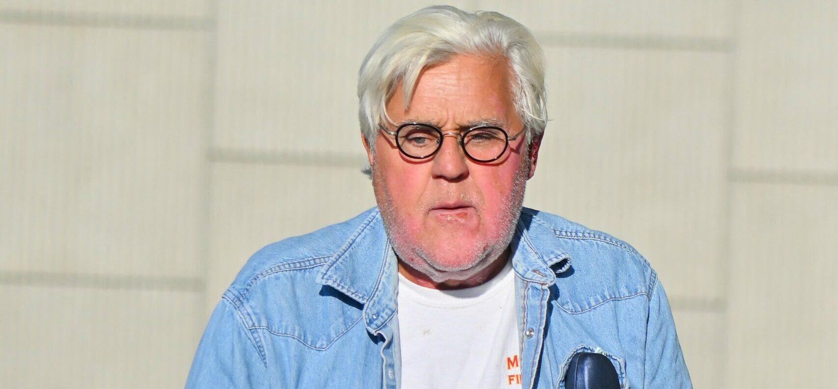 Jay Leno stops by a gas station in yet another cool car after getting out of the hospital yesterday