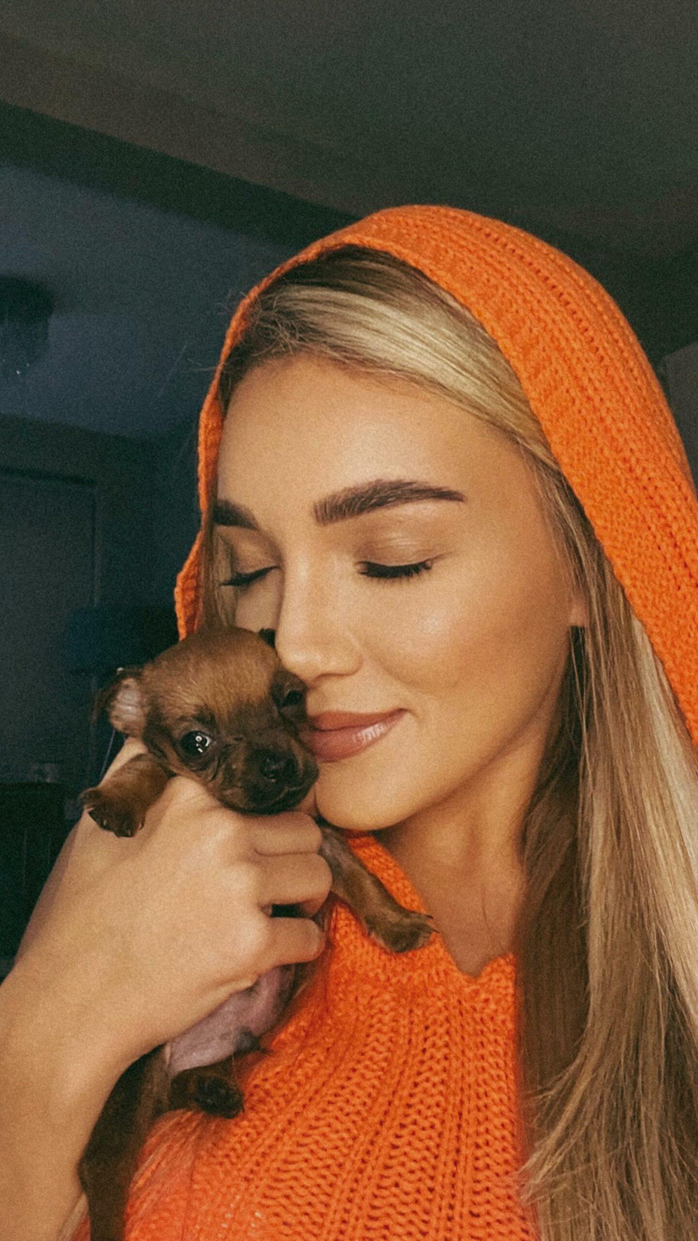 Beaux Raymond poses with her rescue puppy