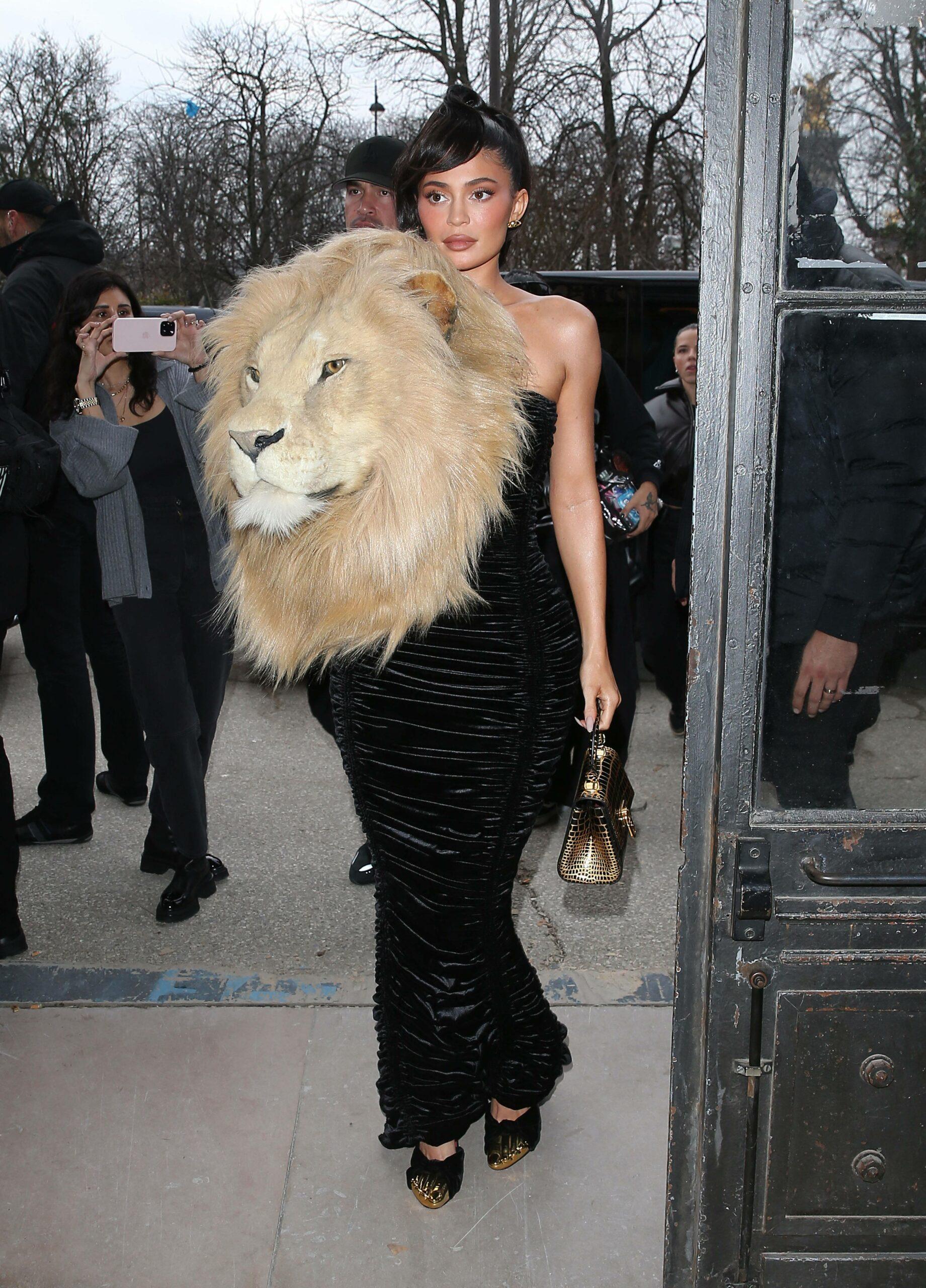 Kylie Jenner Stuns in a black dress with a hand made Lion's Head on the front at the Schiapparelli fashion show in Paris, France