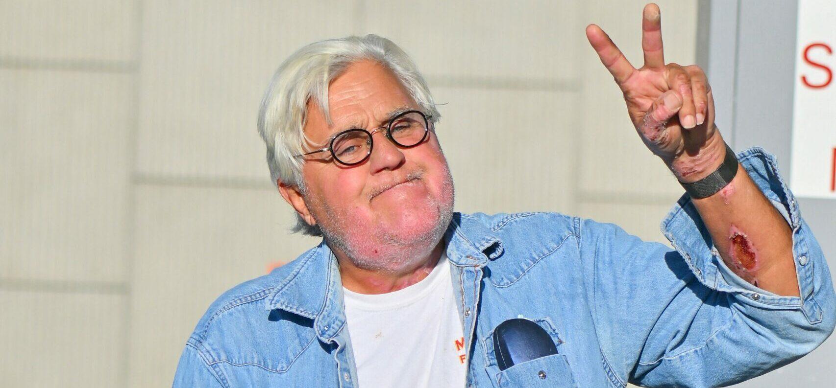 Jay Leno stops by a gas station in yet another cool car after getting out of the hospital yesterday