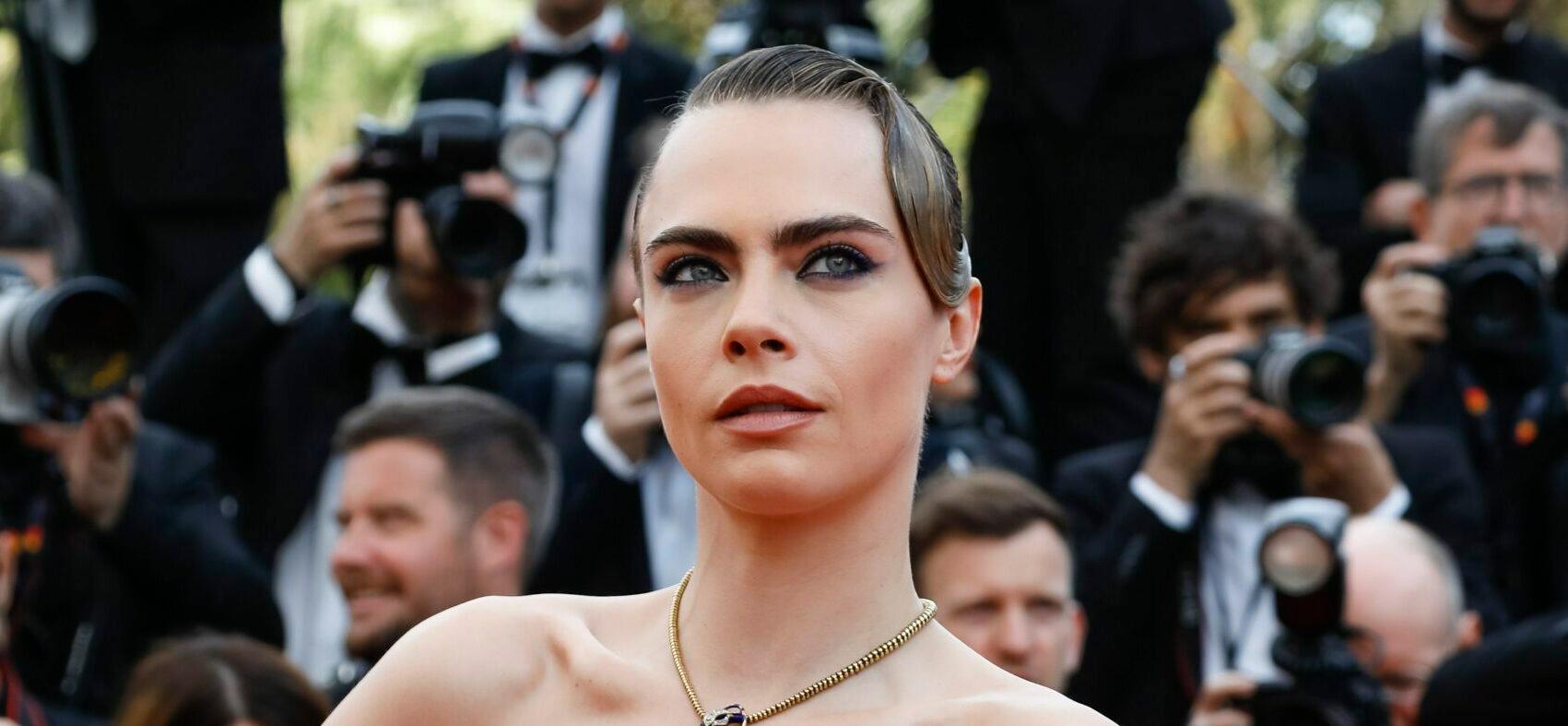 Cara Delevingne Flaunts Toned Abs At Super Bowl While Declaring She’s #TeamRihanna