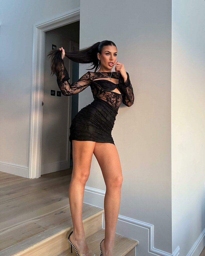 Emily Faye Miller Lets Her Bra Slip Out Of Her Little Black Dress