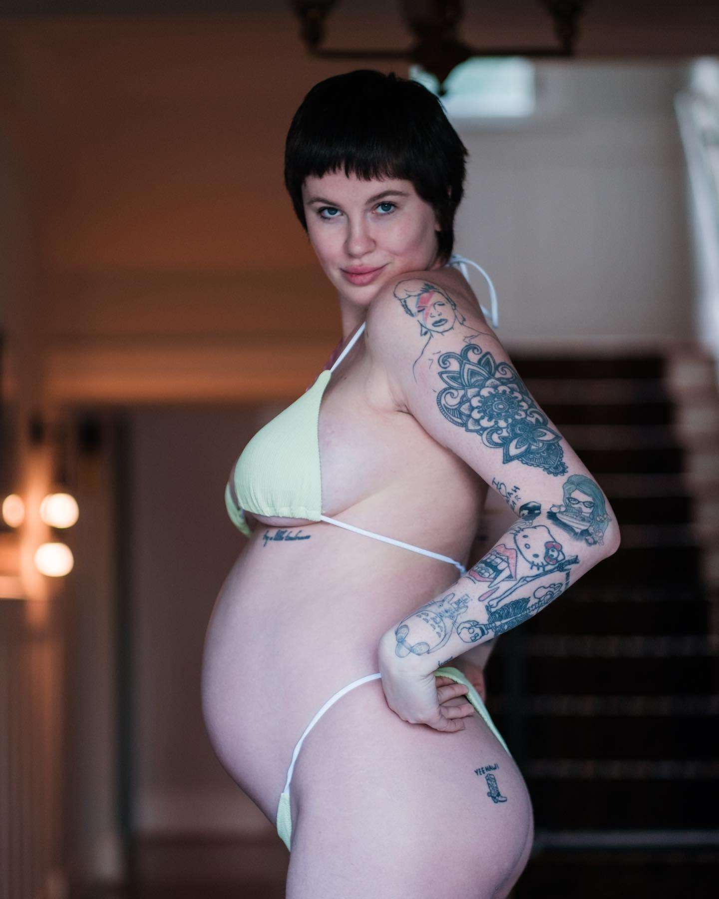 Ireland Baldwin marks the 6 month mark of her first pregnancy posing in a green bikini