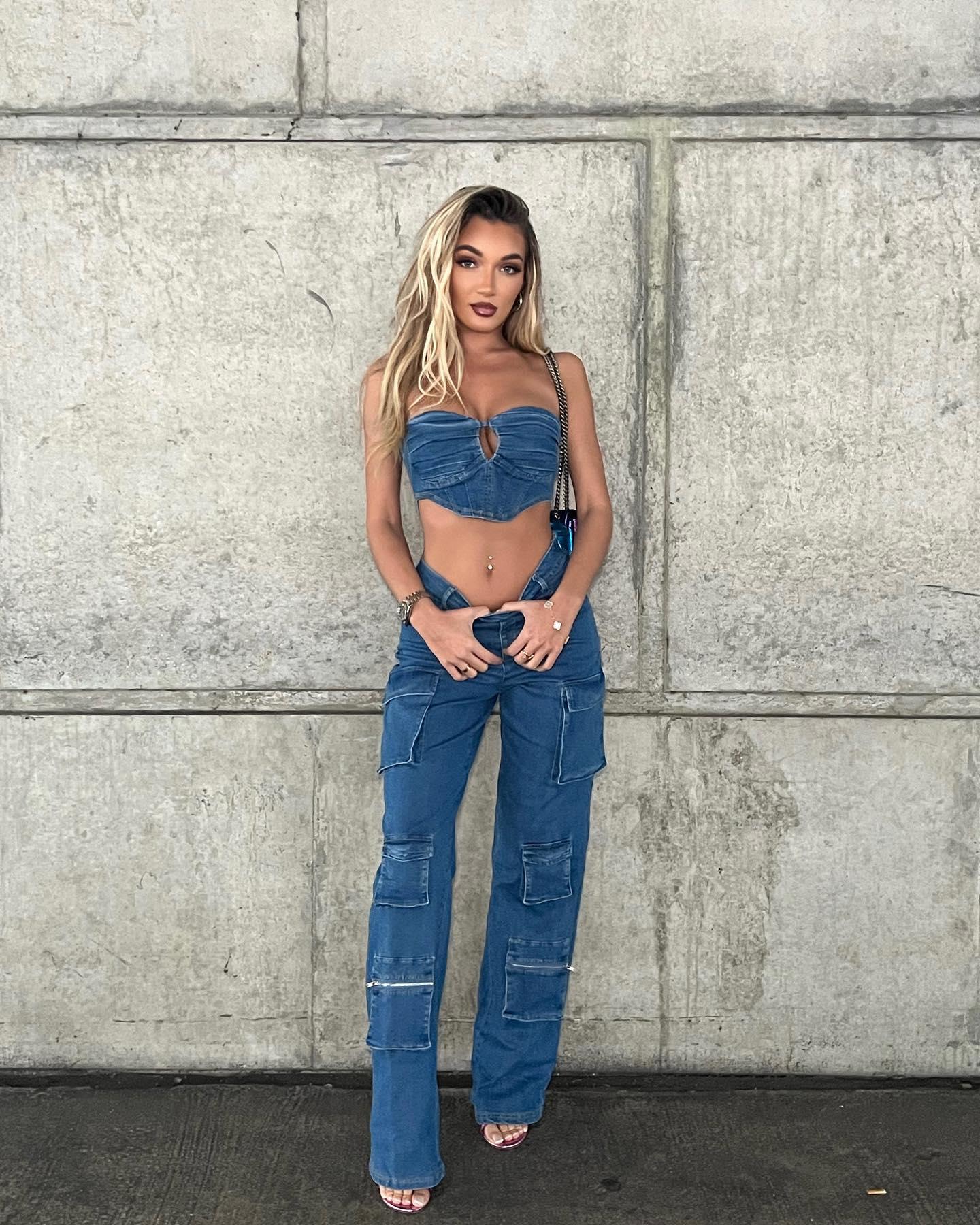 Beaux Raymond poses in a strapless denim crop top