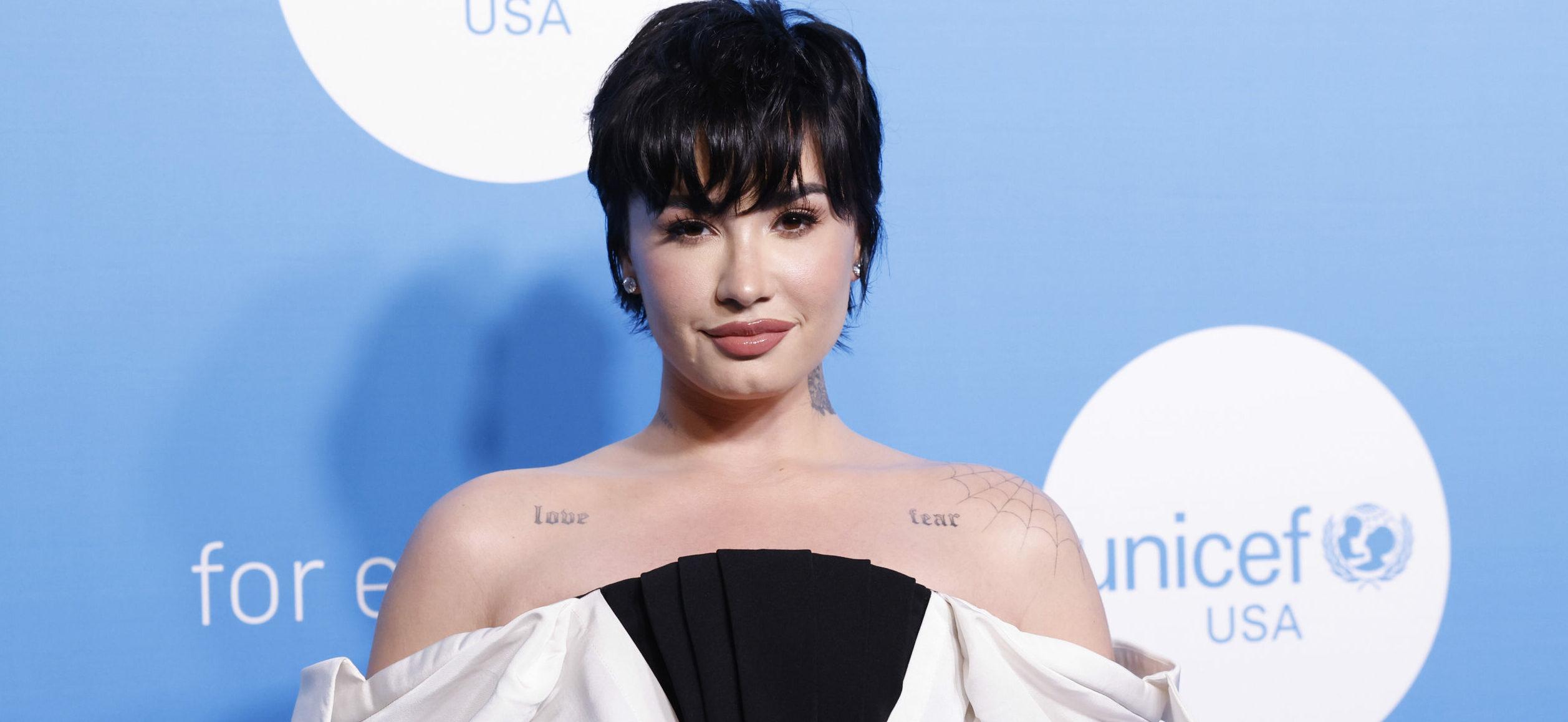 Demi Lovato Bares Tempting Cleavage In Curve-hugging Little Black Dress