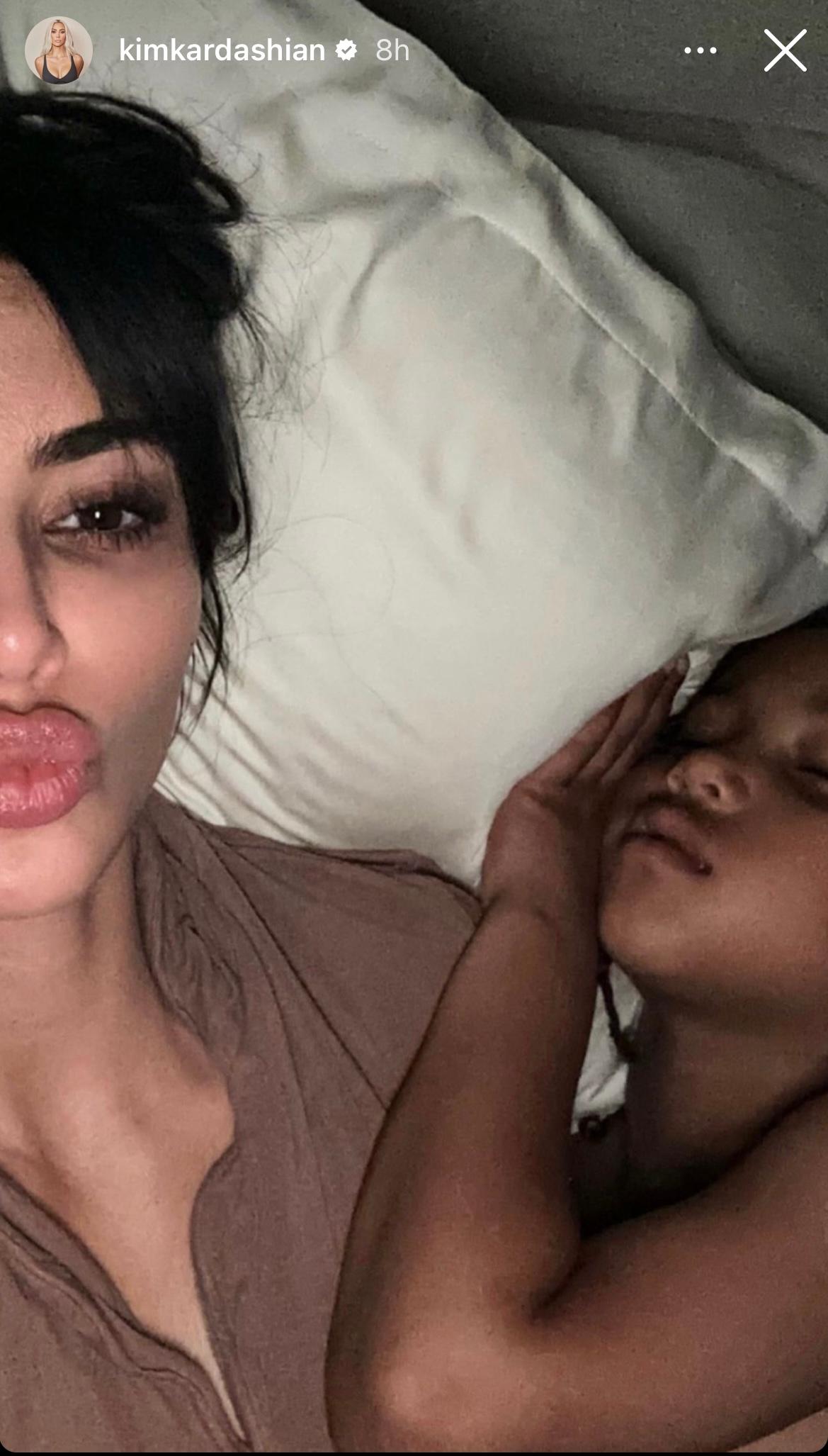 Kim Kardashian and son Saint sleeping in bed