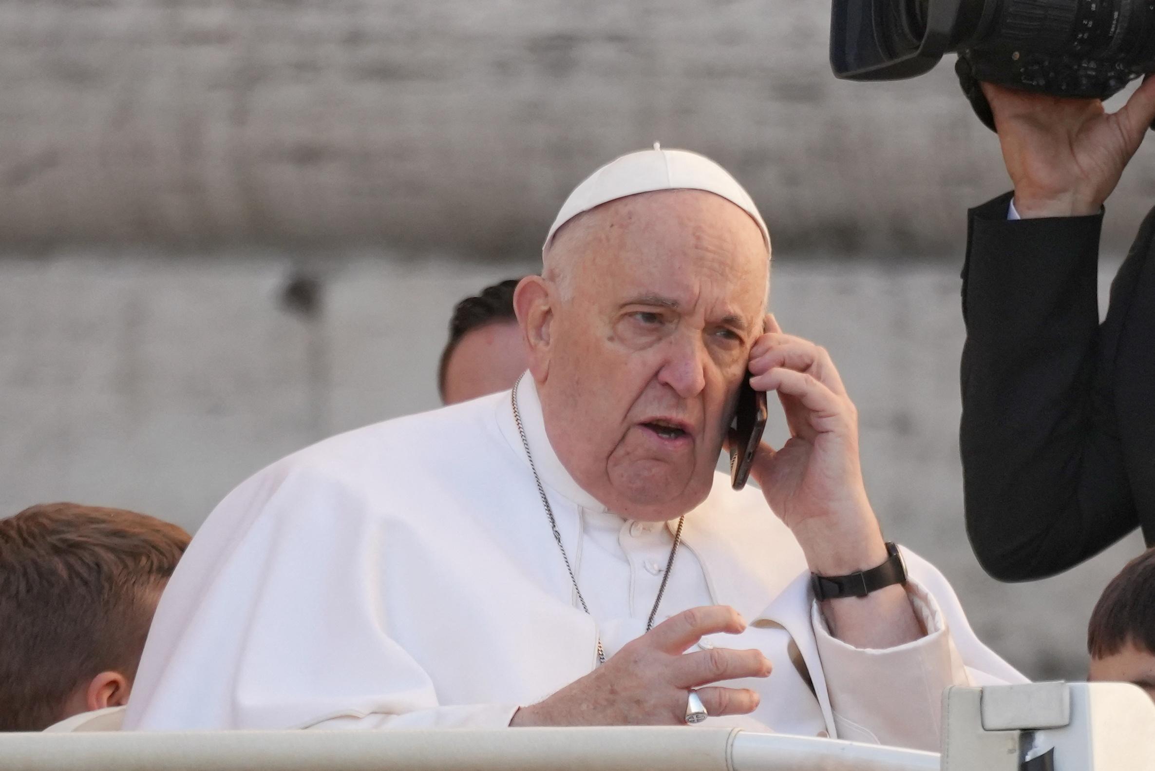 Pope Francis on the phone before the General Audience