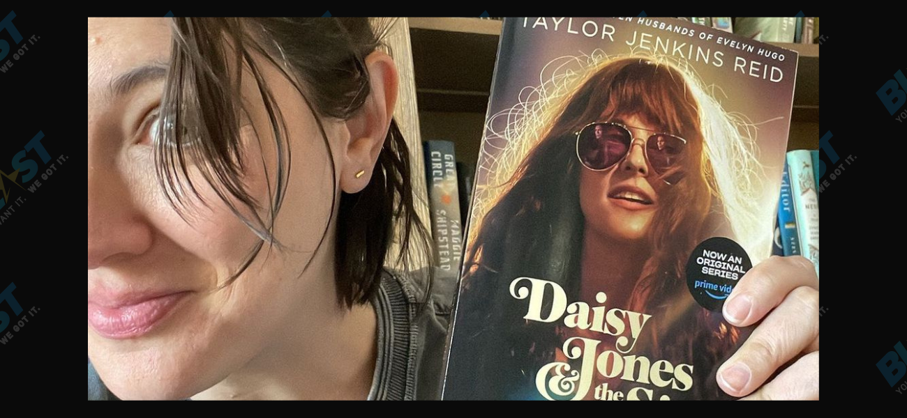 Taylor Jenkins Reid holding copy of Daisy Jones...