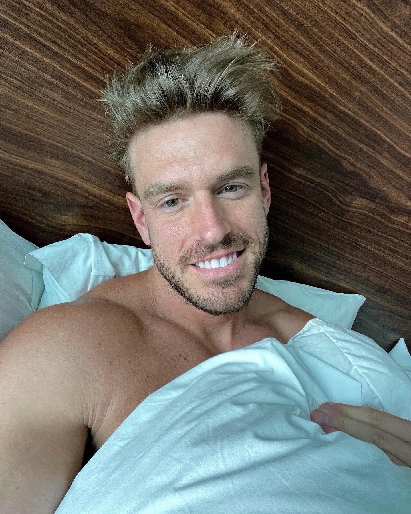 Shayne Jansen takes a selfie in bed