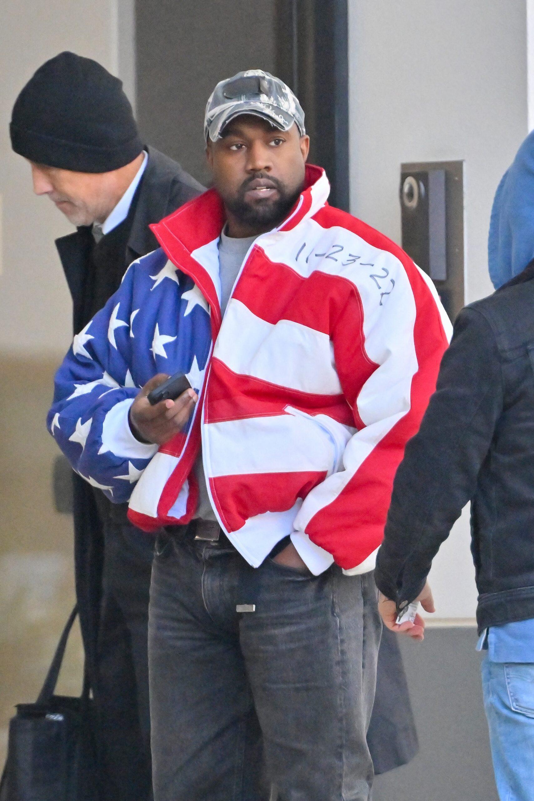 Kanye West heads to a meeting after heading to church wearing an American flag jacket