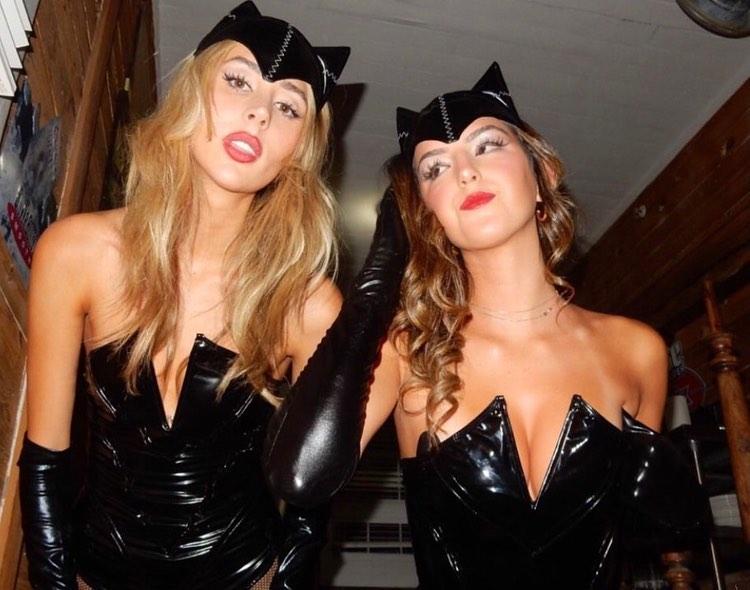 Scarlet Stallone and her friend posing in their Catwoman costumes.