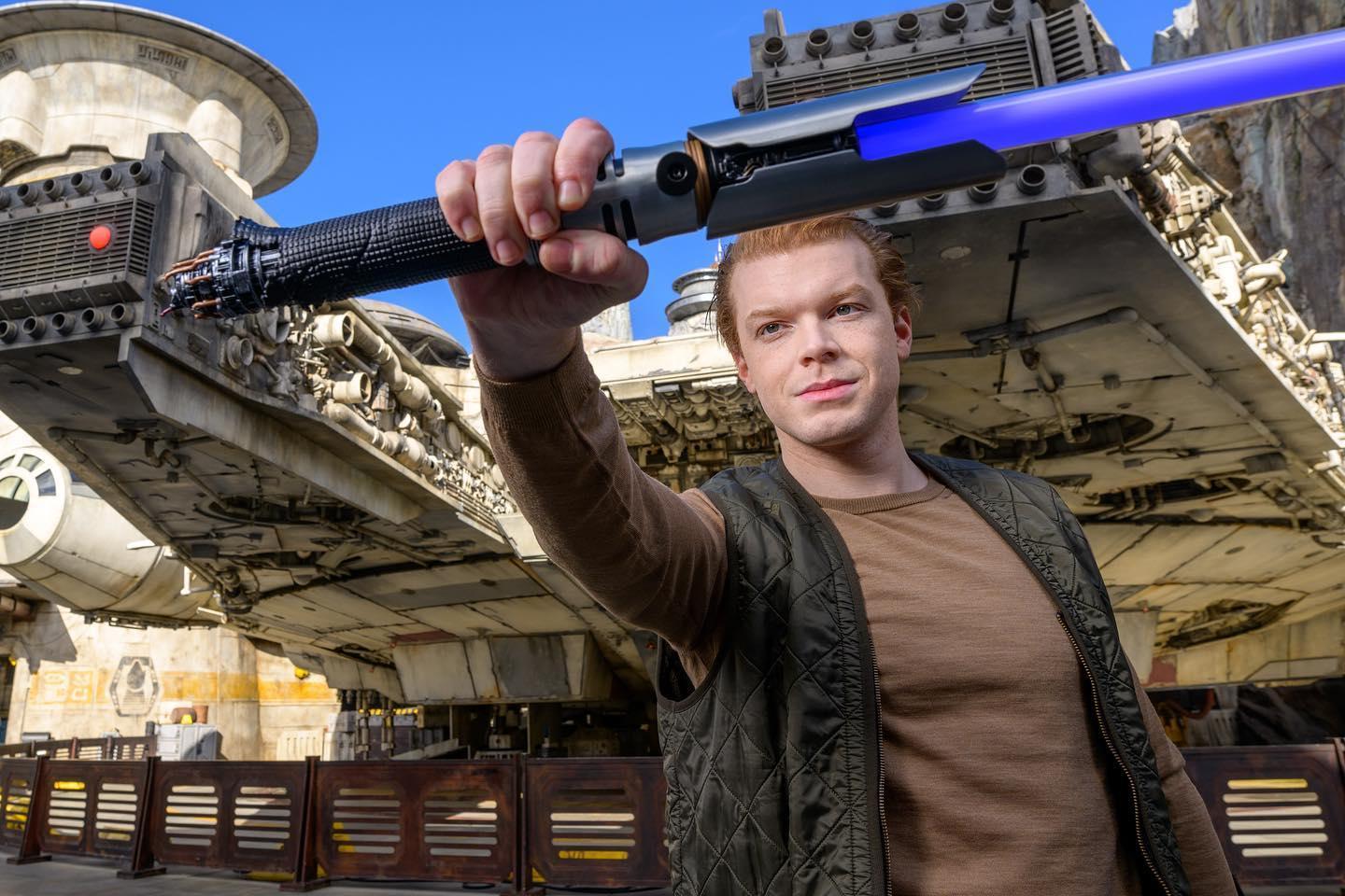 Cameron Monaghan with a lightsaber