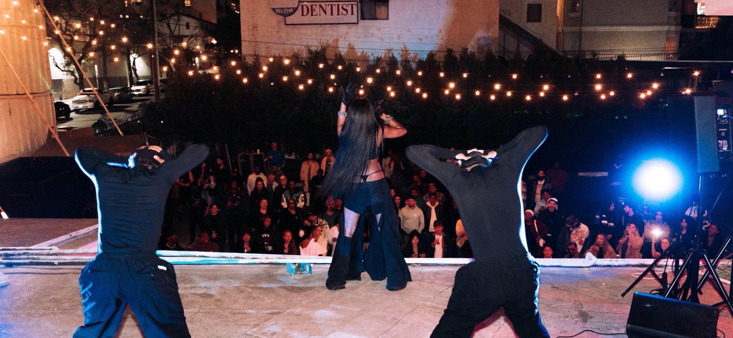 singer, Luck, performing on a rooftop