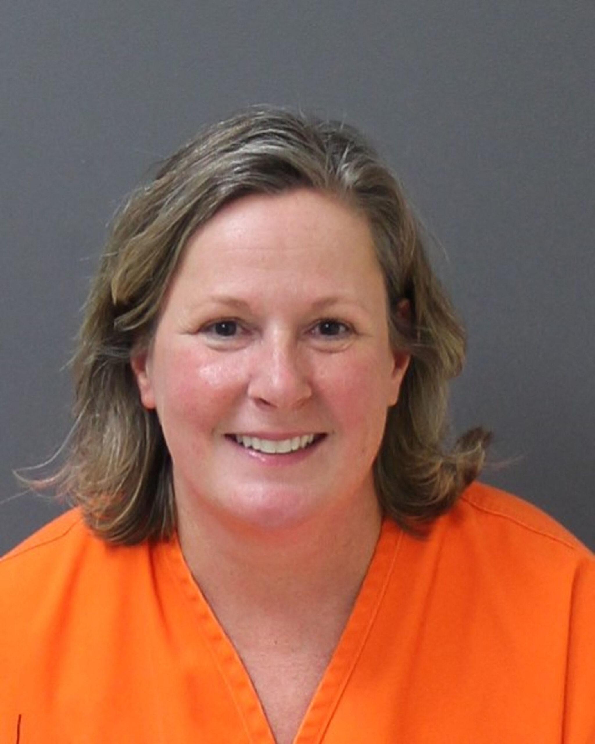 Ex-cop Kim Potter smiles in her mugshot after being found guilty of Daunte Wright manslaughter