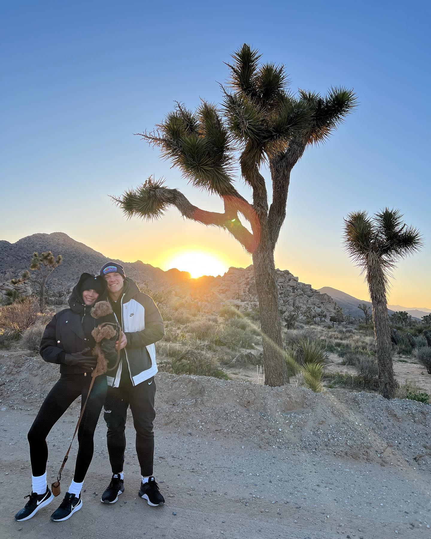 Olivia Culpo poses with Christian McCaffrey and Oliver Sprinkles