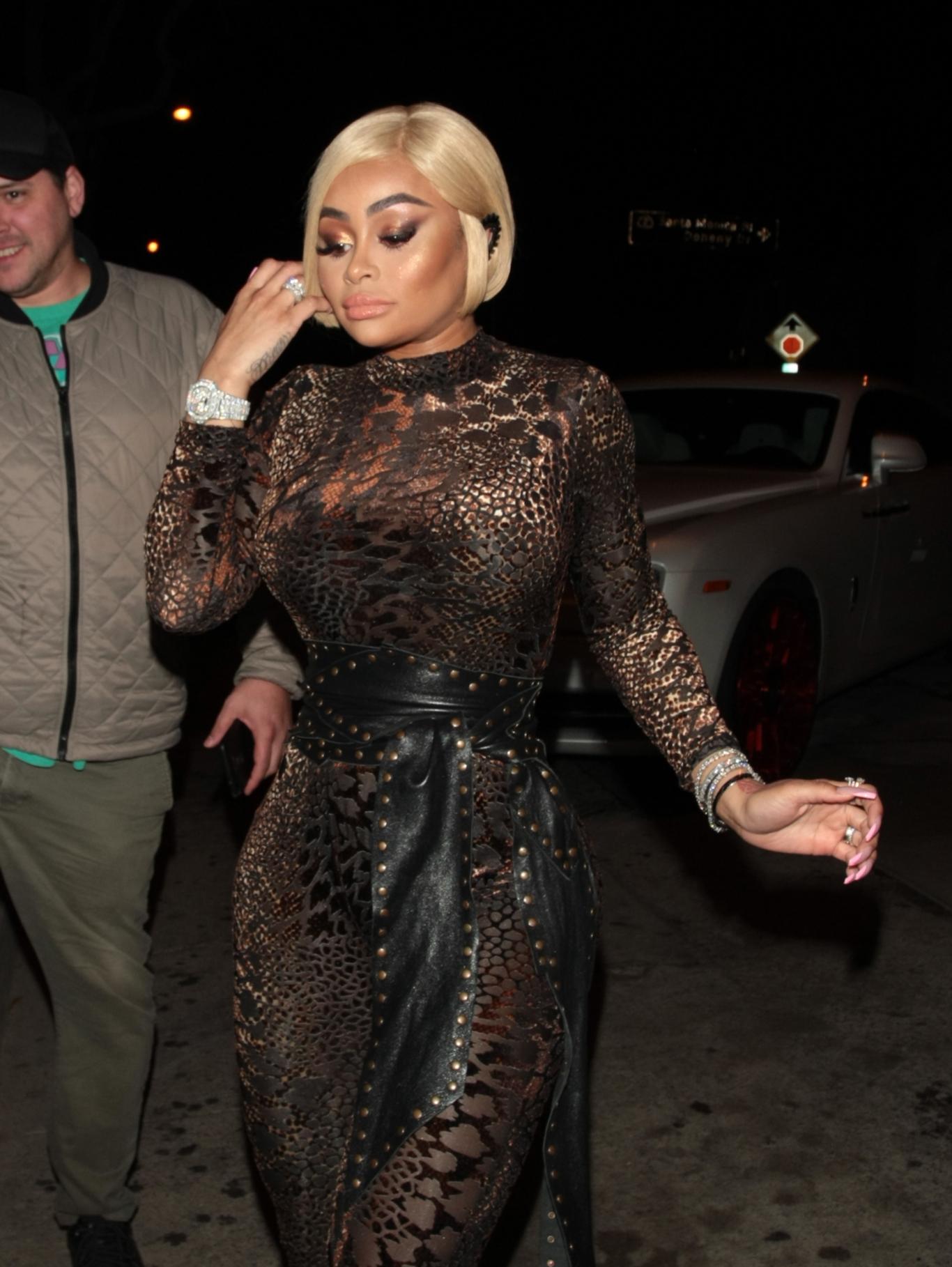 Blac Chyna dine out at Craig apos s wearing a figure-hugging black jump suit