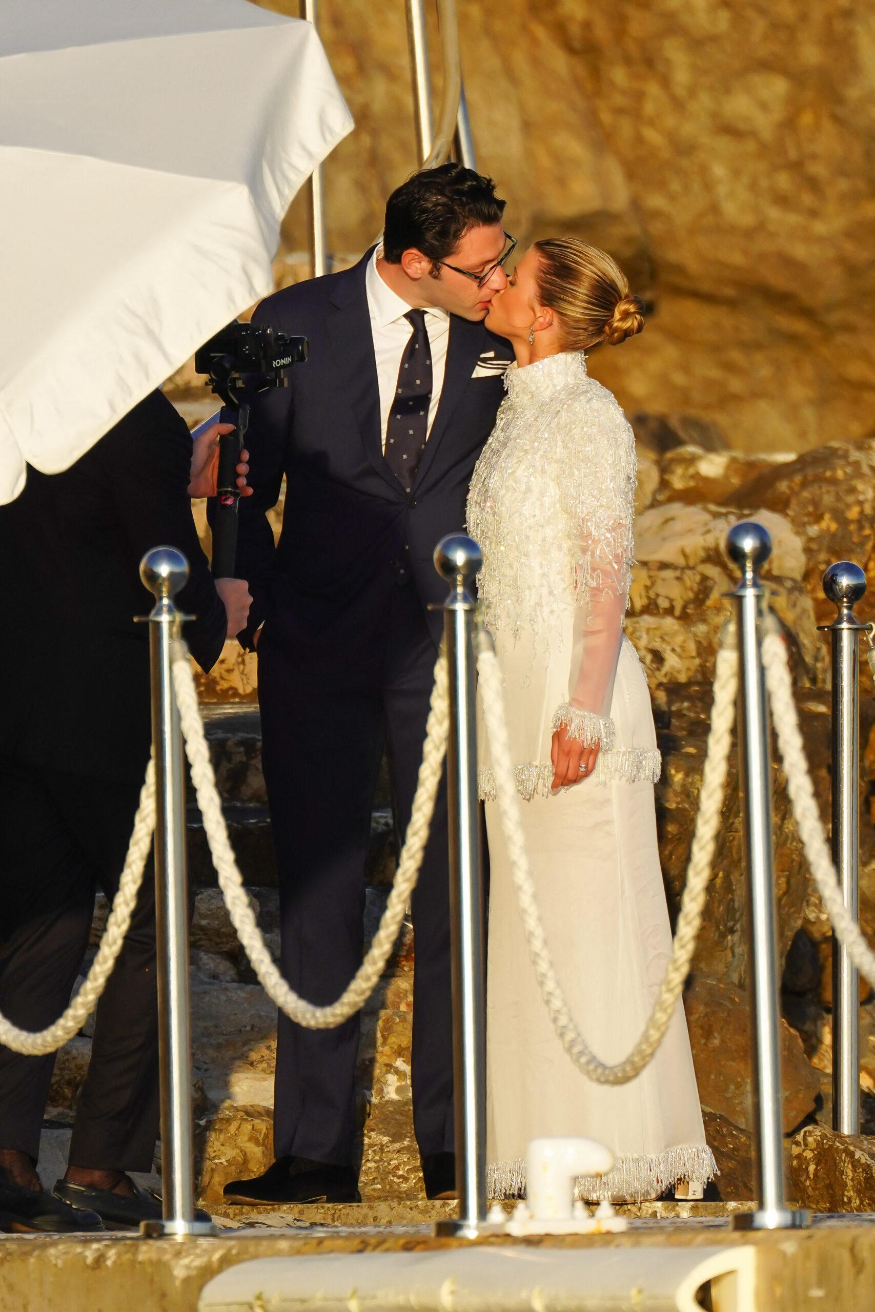 Blushing bride Sofia Richie looks radiant in an elegant white gown as she heads to her lavish wedding rehearsal dinner in the French Riviera