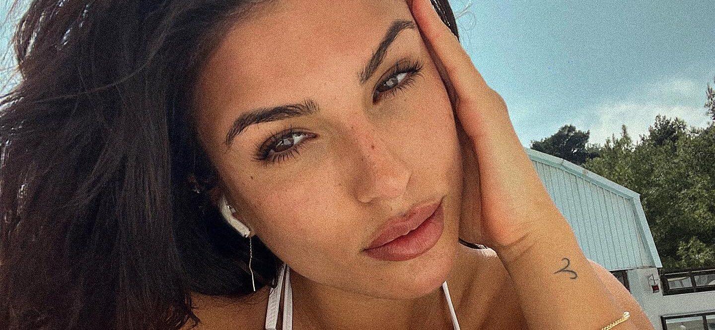 Emily Faye Miller Flaunts Her Toned Abs In White Lingerie