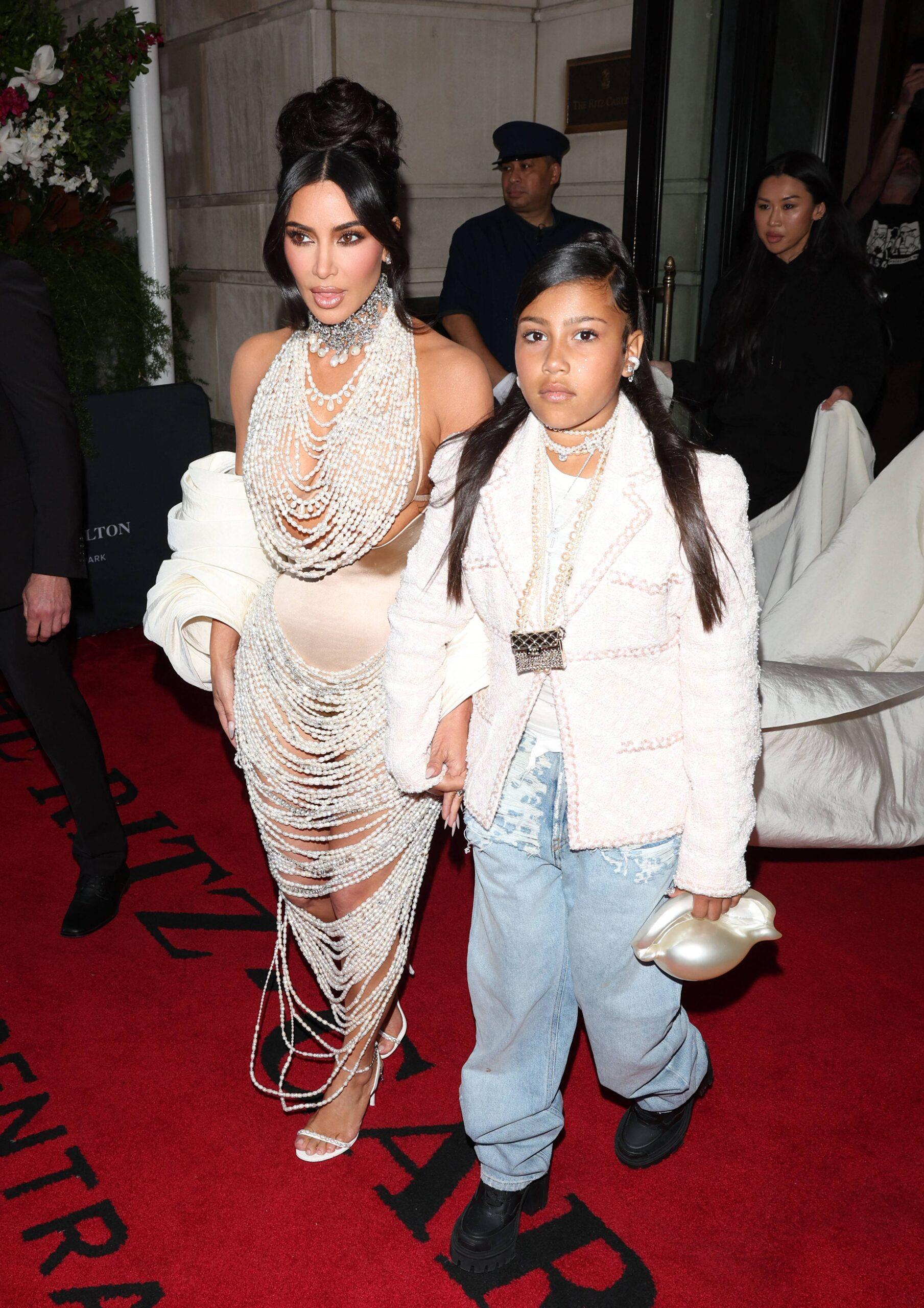 Kim Kardashian Stuns in Pearls with Daughter North West leaving the Ritz Hotel on there way to the Met Gala