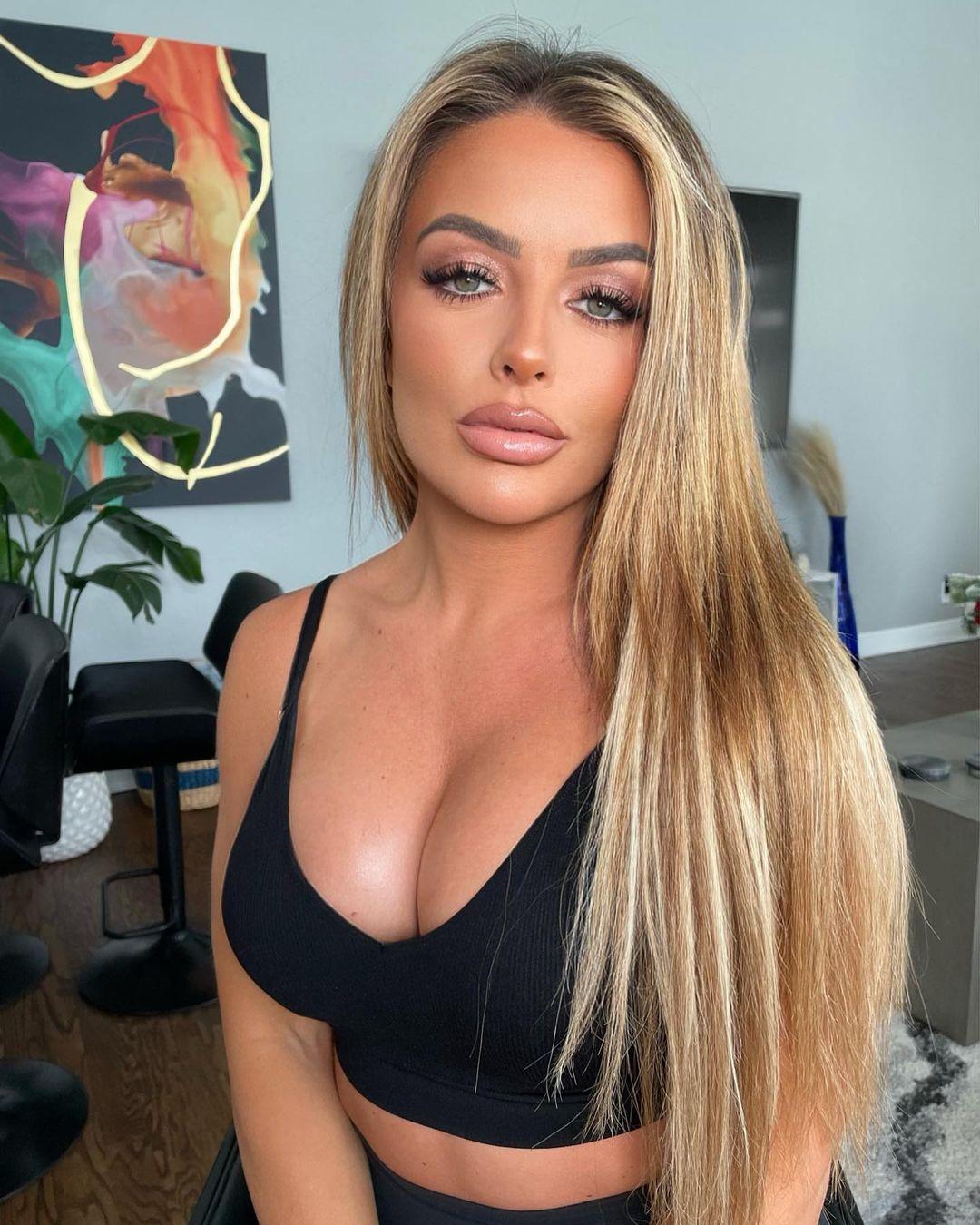 Mandy Rose's Chest Pops Out Of Tight Black Top In 'Sultry' Photo