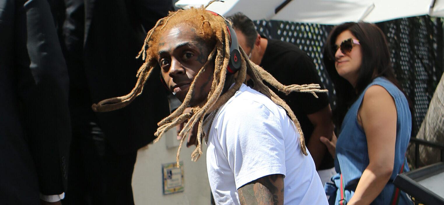 Rapper Lil Wayne sports yellow dreadlocks as he arrives to the wedding of rapper 2 Chainz