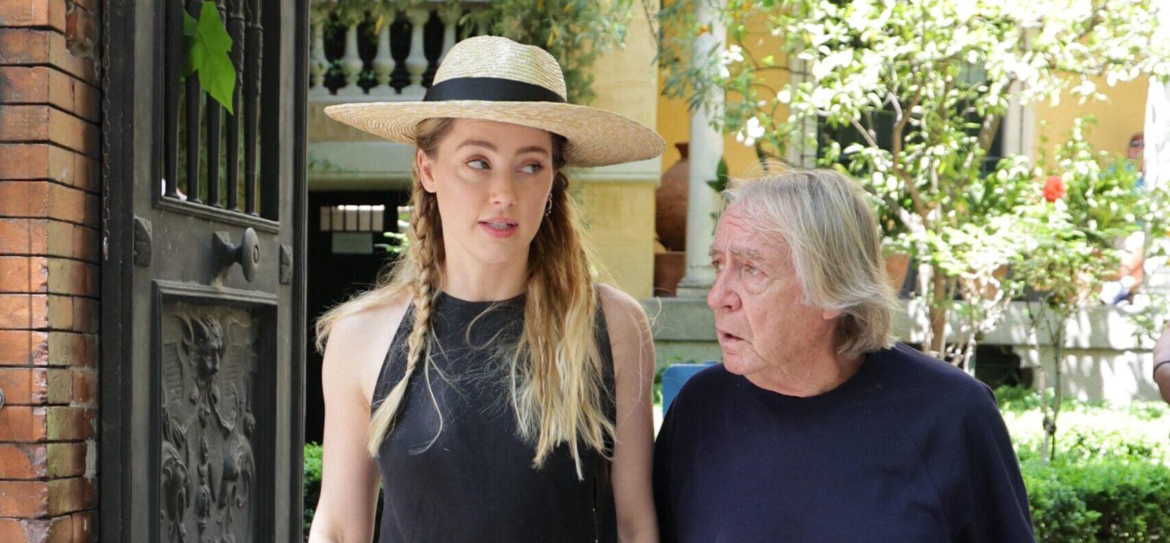 Amber Heard Smiles Awkwardly In Madrid After National Police Leave Her Home