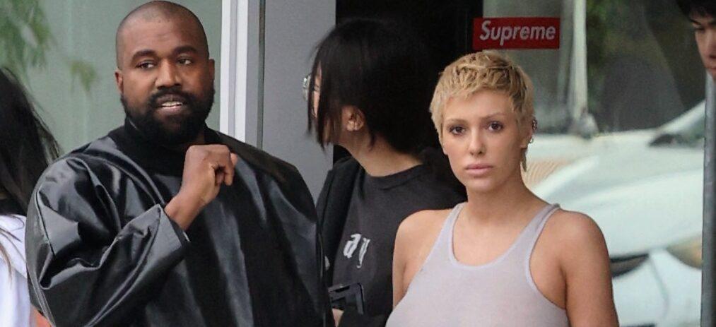 Kanye West & Bianca Censori Are Flanked By Crowd As He Snaps ‘Flesh-Flashing’ Outfit In Italy