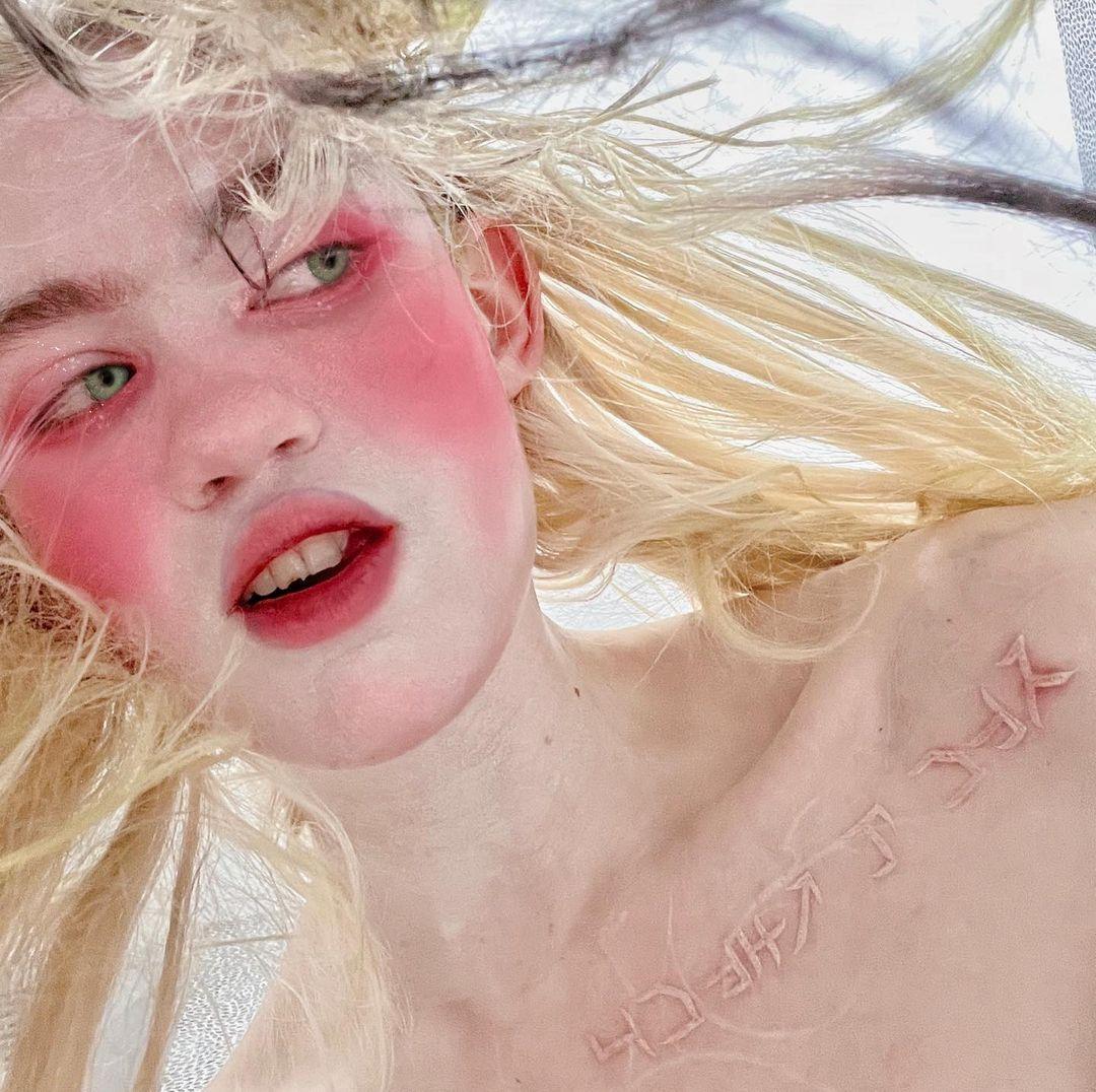 Grimes Shows Off 'Alien Scar' Tattoos As She Promotes Her New Song